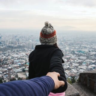 man and woman holding hands